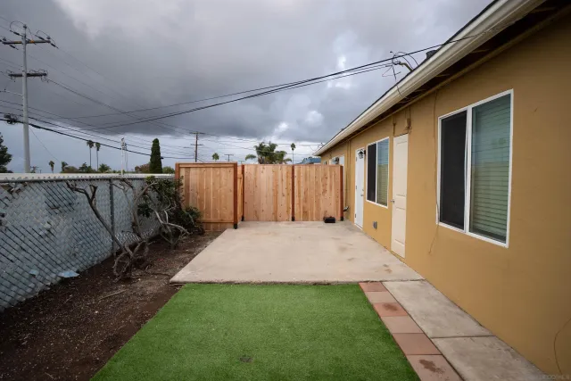 a view of a backyard of the house