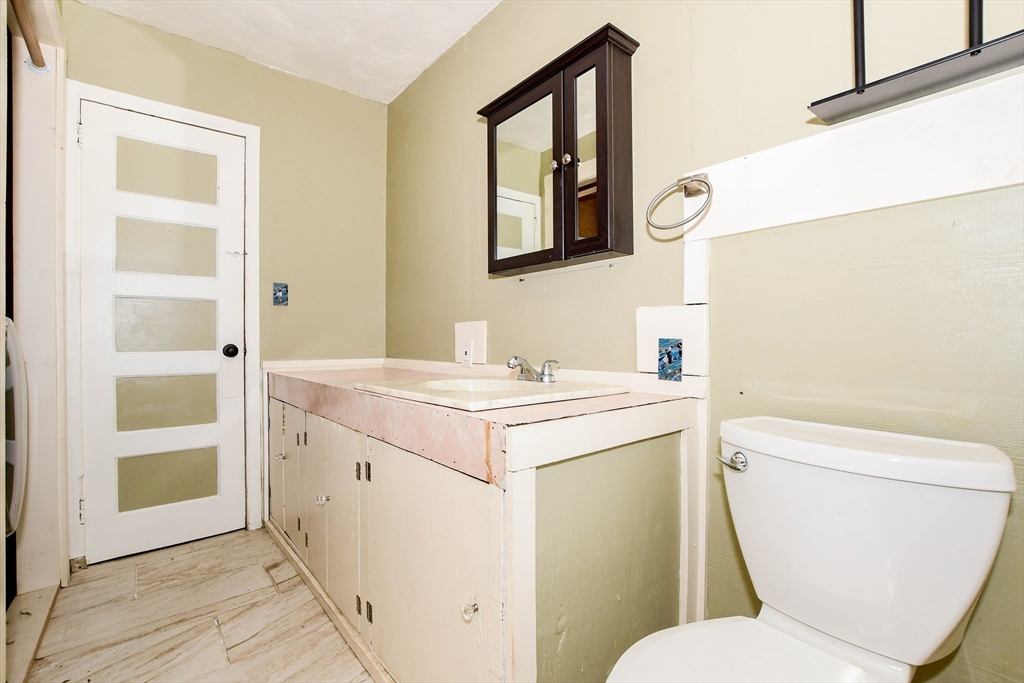 6 Gilbert Way Wareham, MA 02571 - Photo 31 of 41 a bathroom with a granite countertop toilet sink and mirror