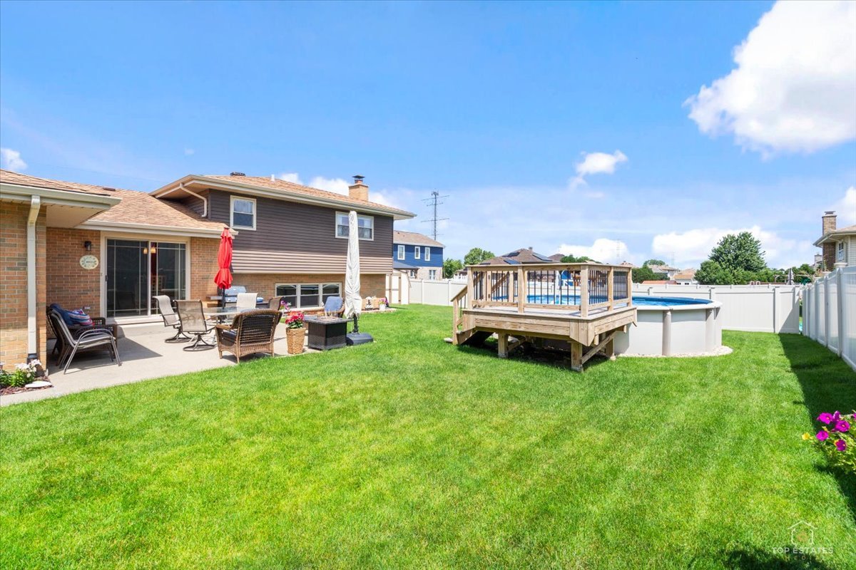 8124 Nottingham Road Tinley Park, IL 60477 - Photo 26 of 33 a view of a house with backyard porch and sitting area