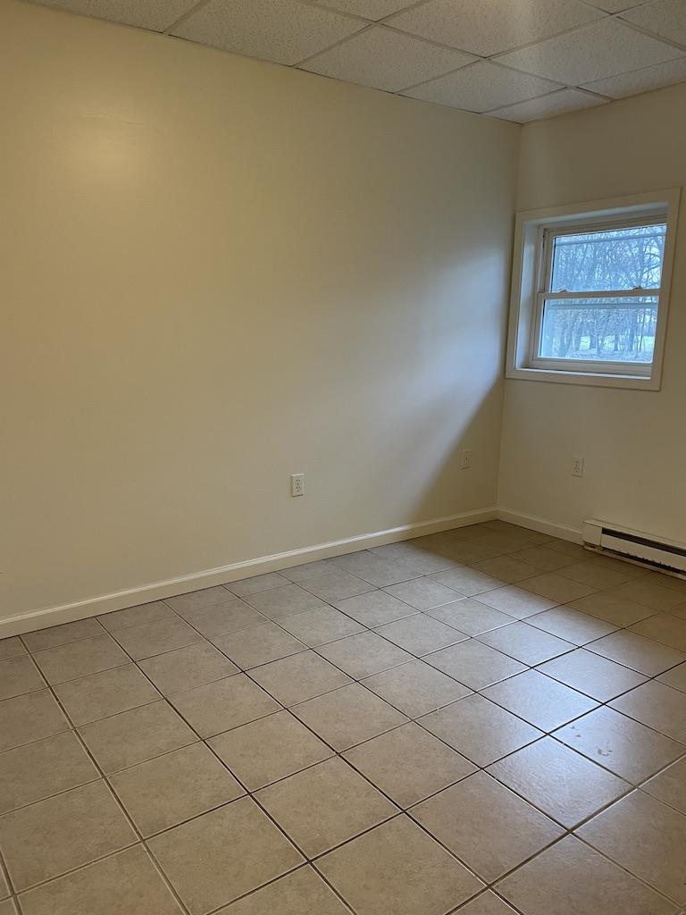 4429 Steuben Road, Unit 101 Bethlehem, PA 18020 - Photo 4 of 10 A well-lit interior space features resilient tile flooring and a view of the outdoors.