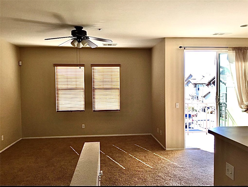 10375 Church Street Rancho Cucamonga, CA 91730 - Photo 2 of 9 a view of an empty room with window and wooden floor
