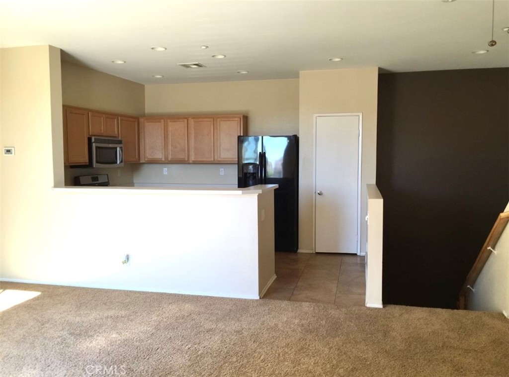 10375 Church Street Rancho Cucamonga, CA 91730 - Photo 4 of 9 a view of kitchen with refrigerator and window