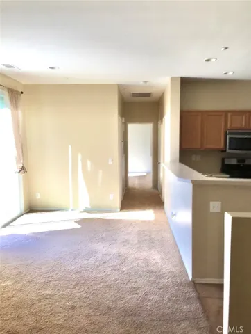 a view of a kitchen with a sink and dishwasher