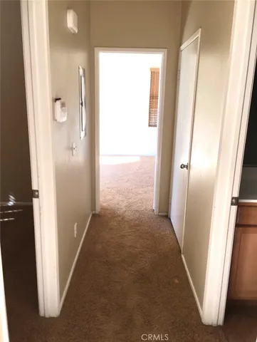 view of a hallway with wooden floor