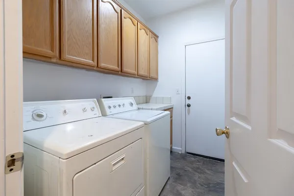 a utility room with dryer and washer