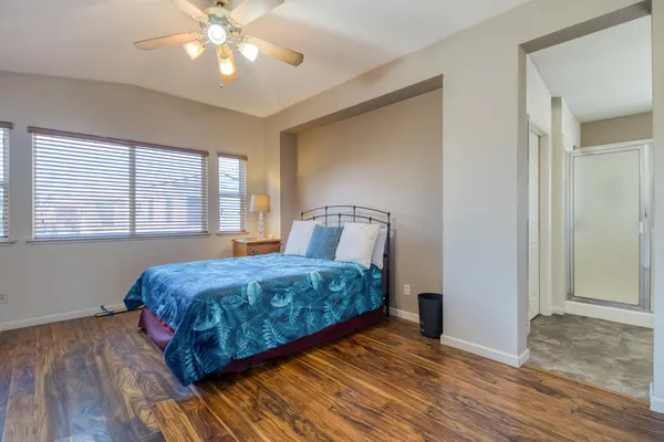 a bedroom with a bed and window
