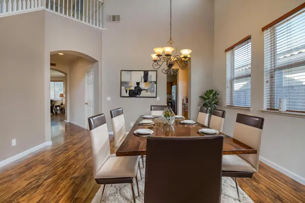 a view of a dining room with furniture window and wooden floor