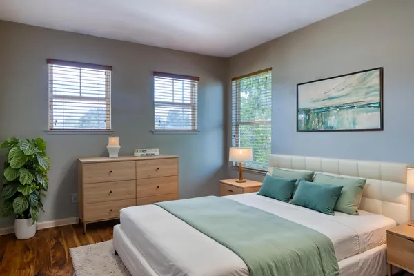 a bed room with a bed and a window
