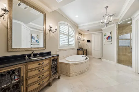 a bathroom with a sink a mirror and next to a window