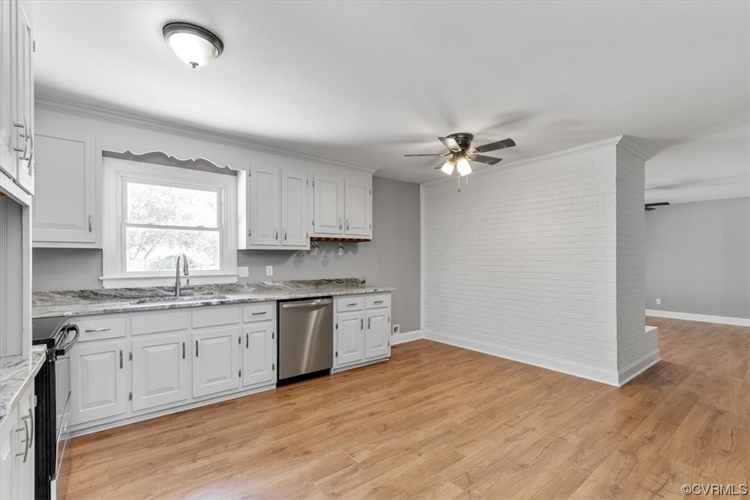 3208 Osborne Road Chester, VA 23831 - Photo 12 of 50 a kitchen with a sink cabinets appliances and a window