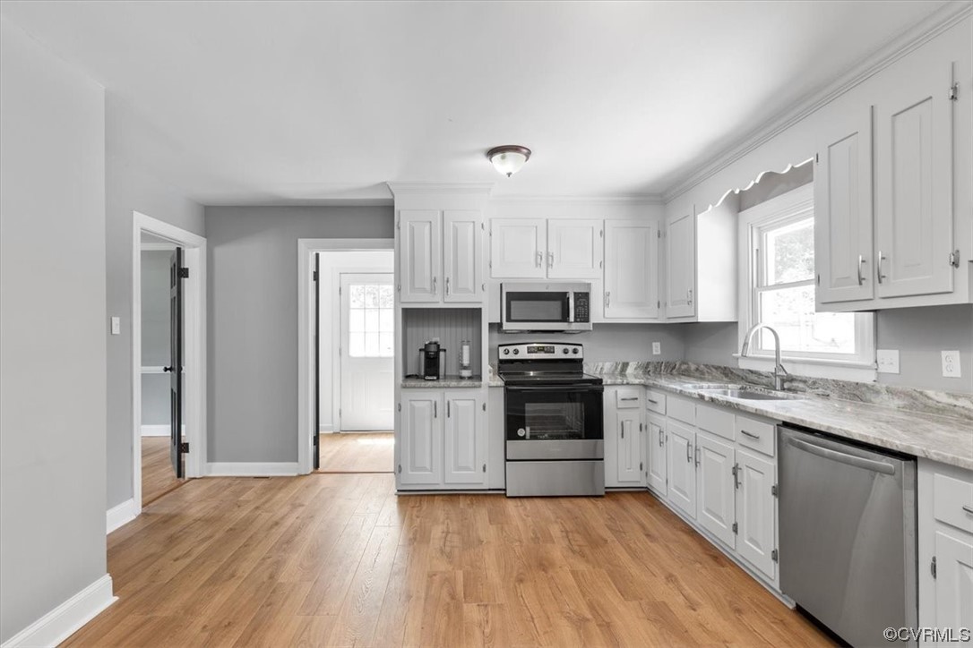 3208 Osborne Road Chester, VA 23831 - Photo 15 of 50 a kitchen with stainless steel appliances granite countertop a stove top oven a sink dishwasher and a refrigerator