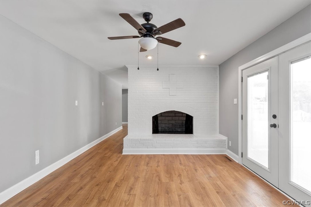 3208 Osborne Road Chester, VA 23831 - Photo 23 of 50 a living room with hard wood floors and a ceiling fan
