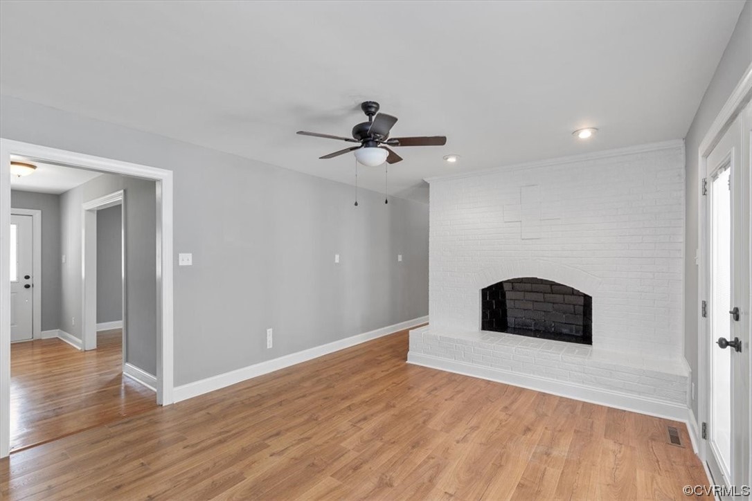 3208 Osborne Road Chester, VA 23831 - Photo 24 of 50 a view of a livingroom with wooden floor and a ceiling fan