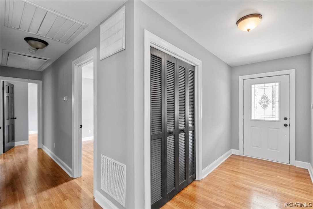 3208 Osborne Road Chester, VA 23831 - Photo 25 of 50 a view of a hallway to a room with wooden floor and staircase
