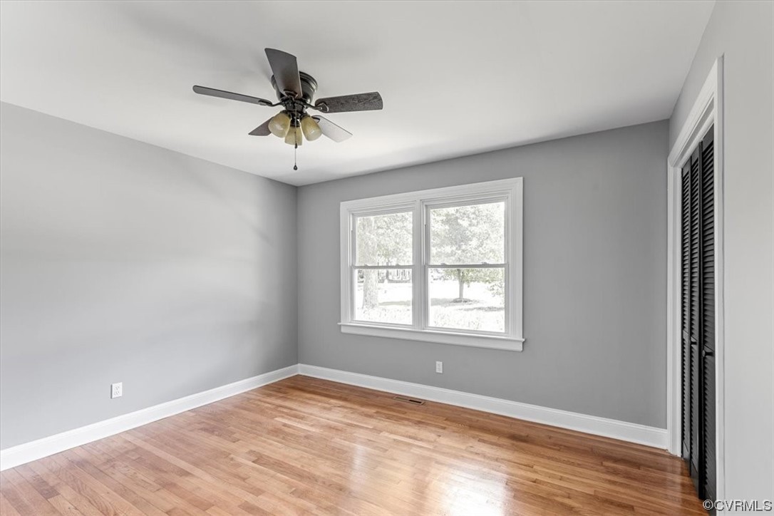 3208 Osborne Road Chester, VA 23831 - Photo 27 of 50 a view of a livingroom with a window and a ceiling fan