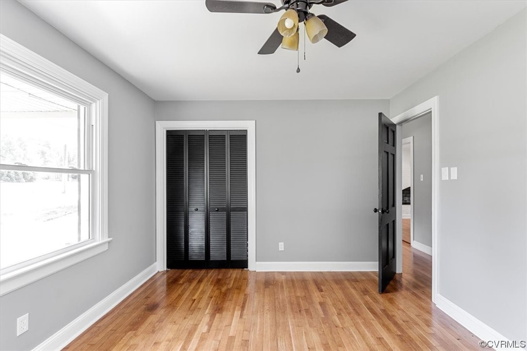 3208 Osborne Road Chester, VA 23831 - Photo 29 of 50 a view of an empty room with wooden floor and a window