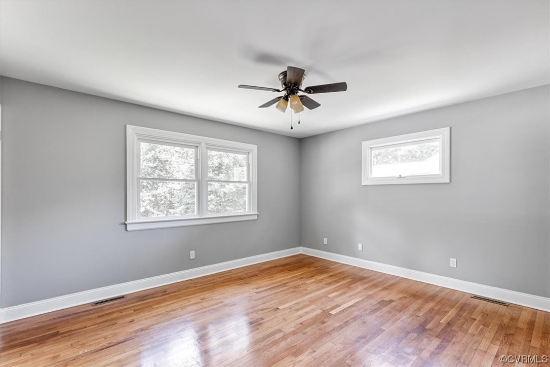 3208 Osborne Road Chester, VA 23831 - Photo 34 of 50 a view of empty room with wooden floor and fan