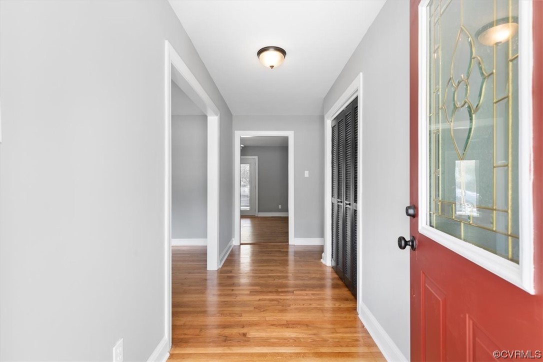 3208 Osborne Road Chester, VA 23831 - Photo 4 of 50 a view of a hallway with wooden floor and glass door