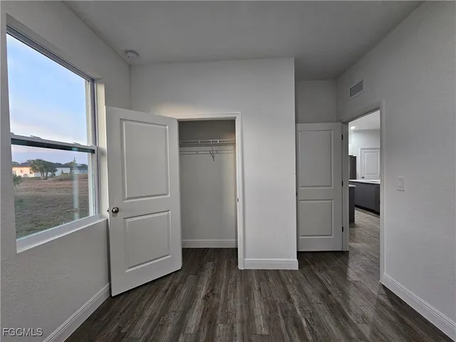 a view of a hardwood floor in hallway