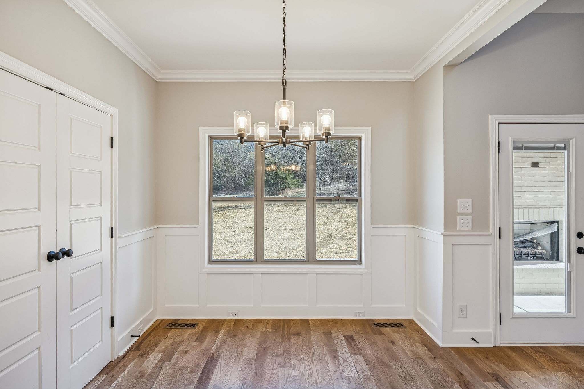 13781 Cainsville Road Lebanon, TN 37090 - Photo 24 of 72 a view of a room with wooden floor chandeliers and kitchen view