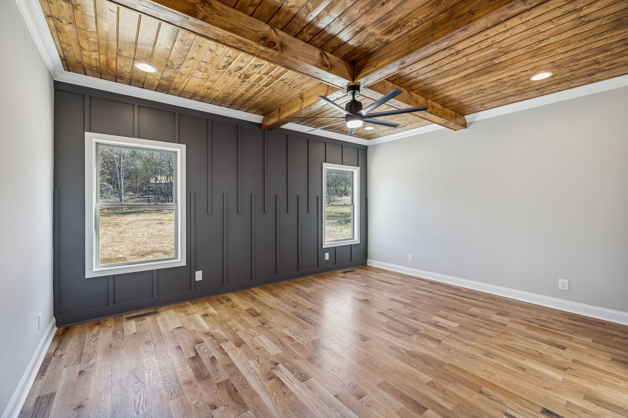 13781 Cainsville Road Lebanon, TN 37090 - Photo 26 of 72 a view of an empty room with wooden floor and a ceiling fan