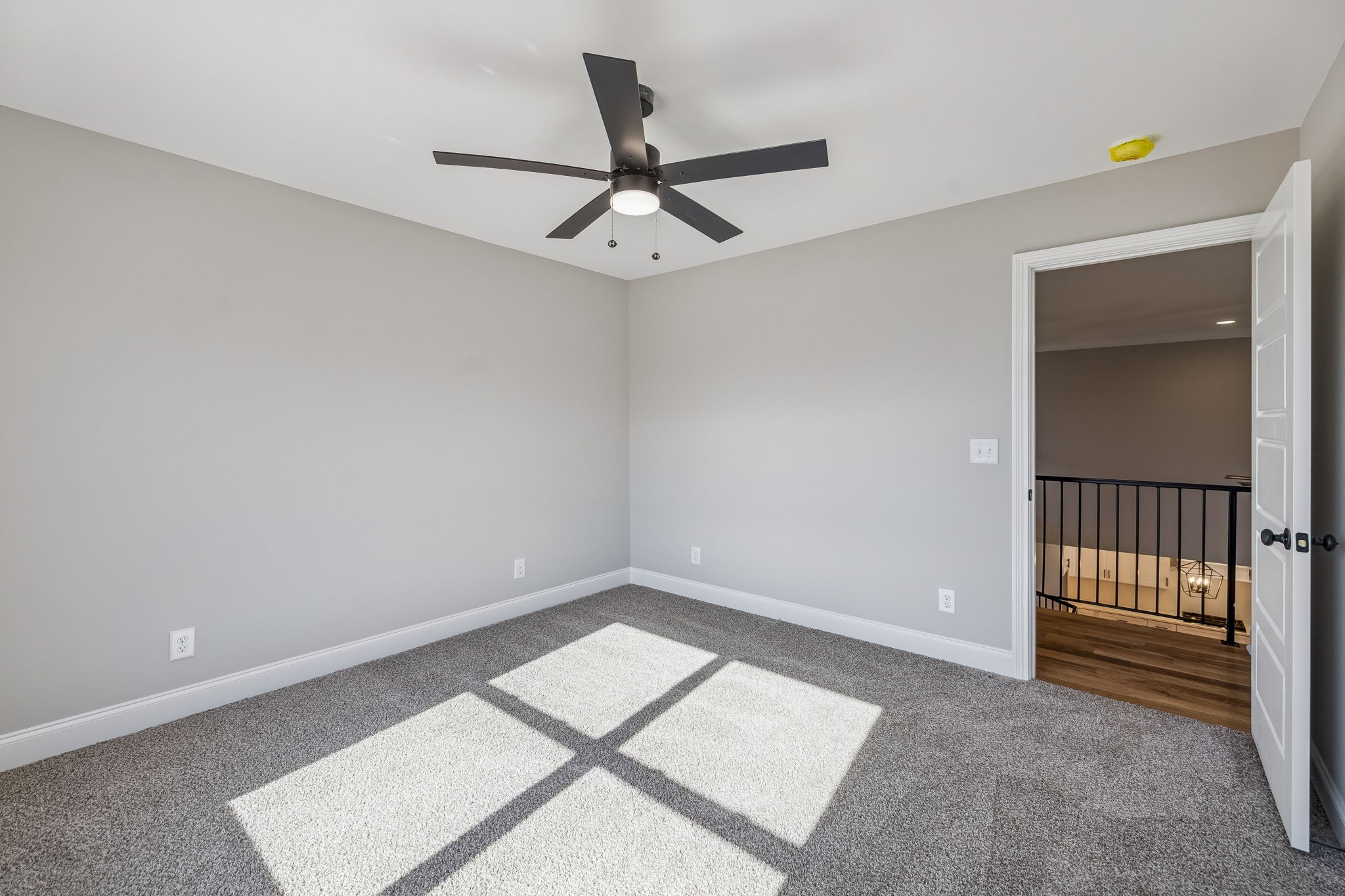 13781 Cainsville Road Lebanon, TN 37090 - Photo 44 of 72 an empty room with a ceiling fan and carpet