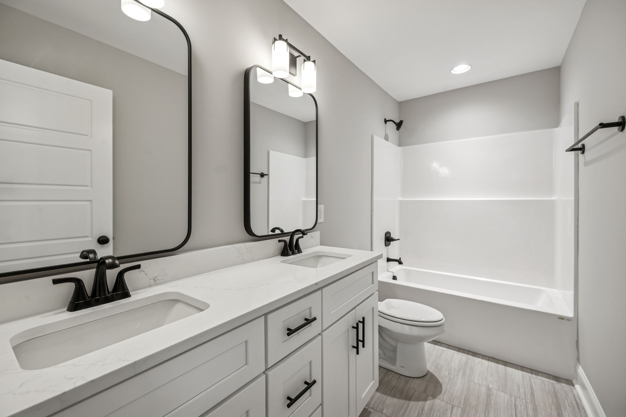 13781 Cainsville Road Lebanon, TN 37090 - Photo 45 of 72 a bathroom with a granite countertop sink toilet a mirror and shower