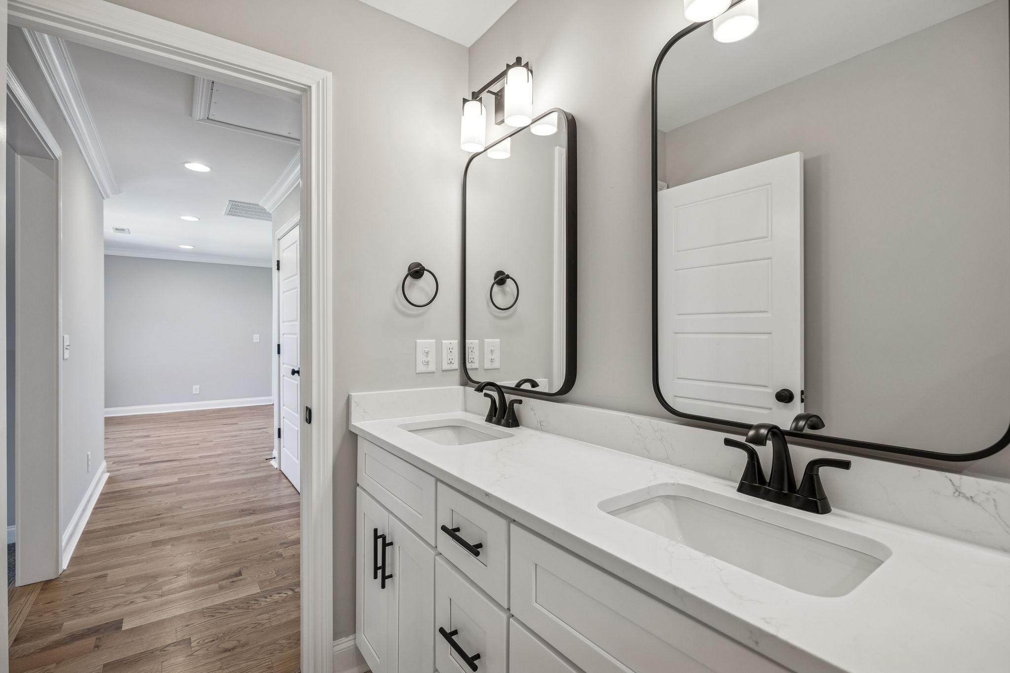 13781 Cainsville Road Lebanon, TN 37090 - Photo 46 of 72 a bathroom with double vanity sinks and a mirror