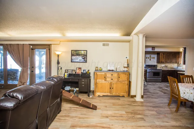 a living room with furniture window and a table
