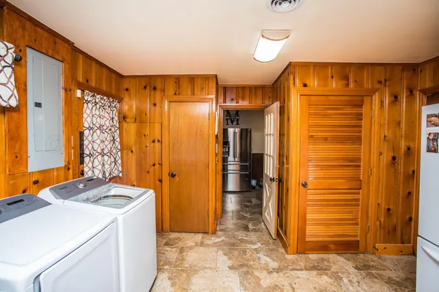 a bedroom with a large bed and a closet