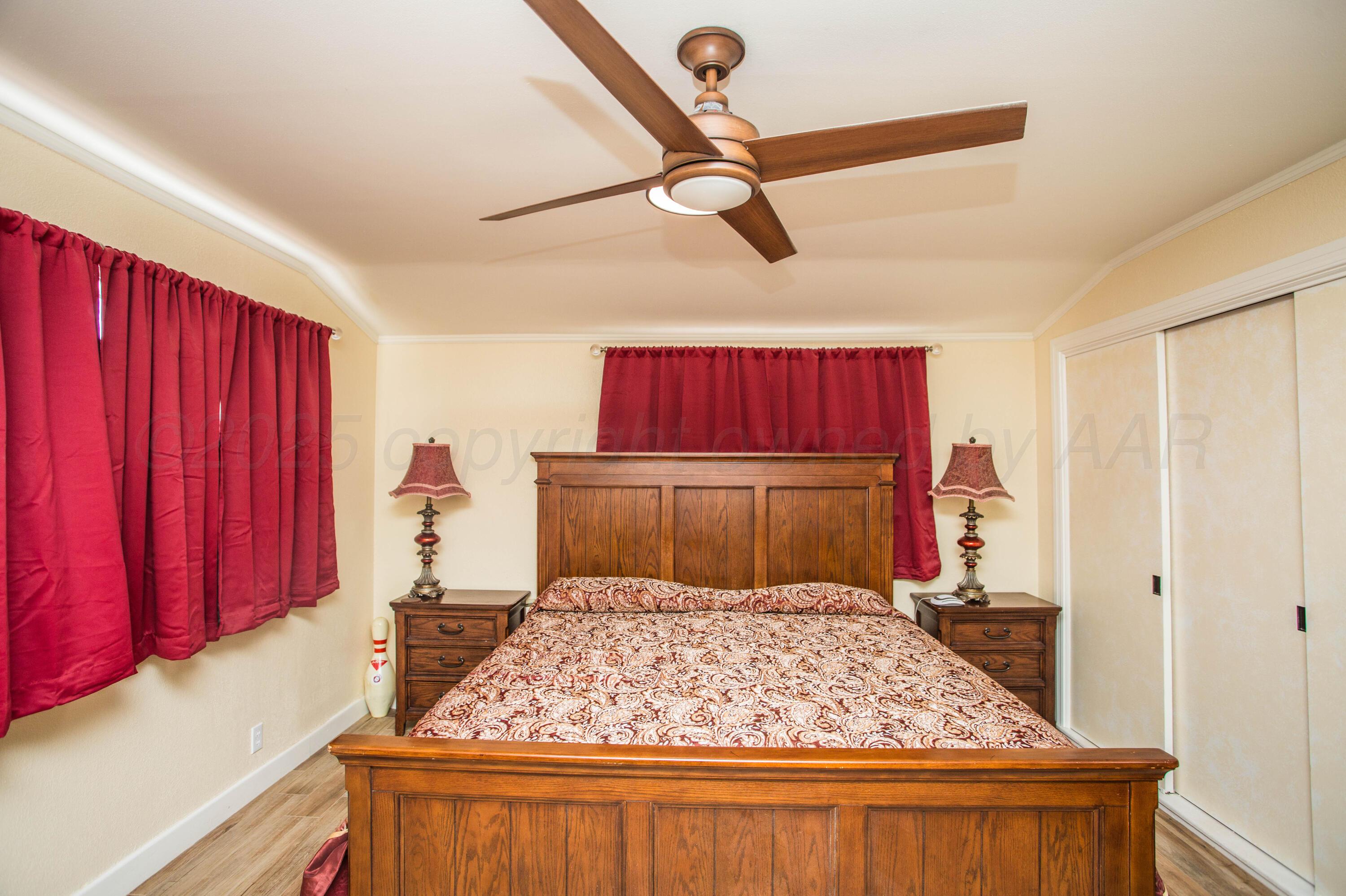 402 Northwest 6th Street Tulia, TX 79088 - Photo 25 of 59 a bedroom with a large bed and a closet