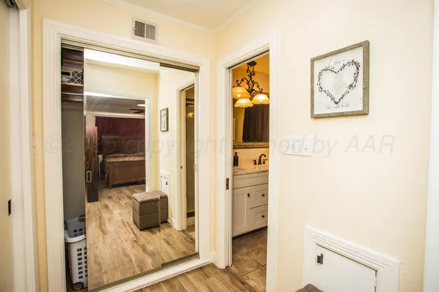 a bathroom with a toilet and a shower curtain