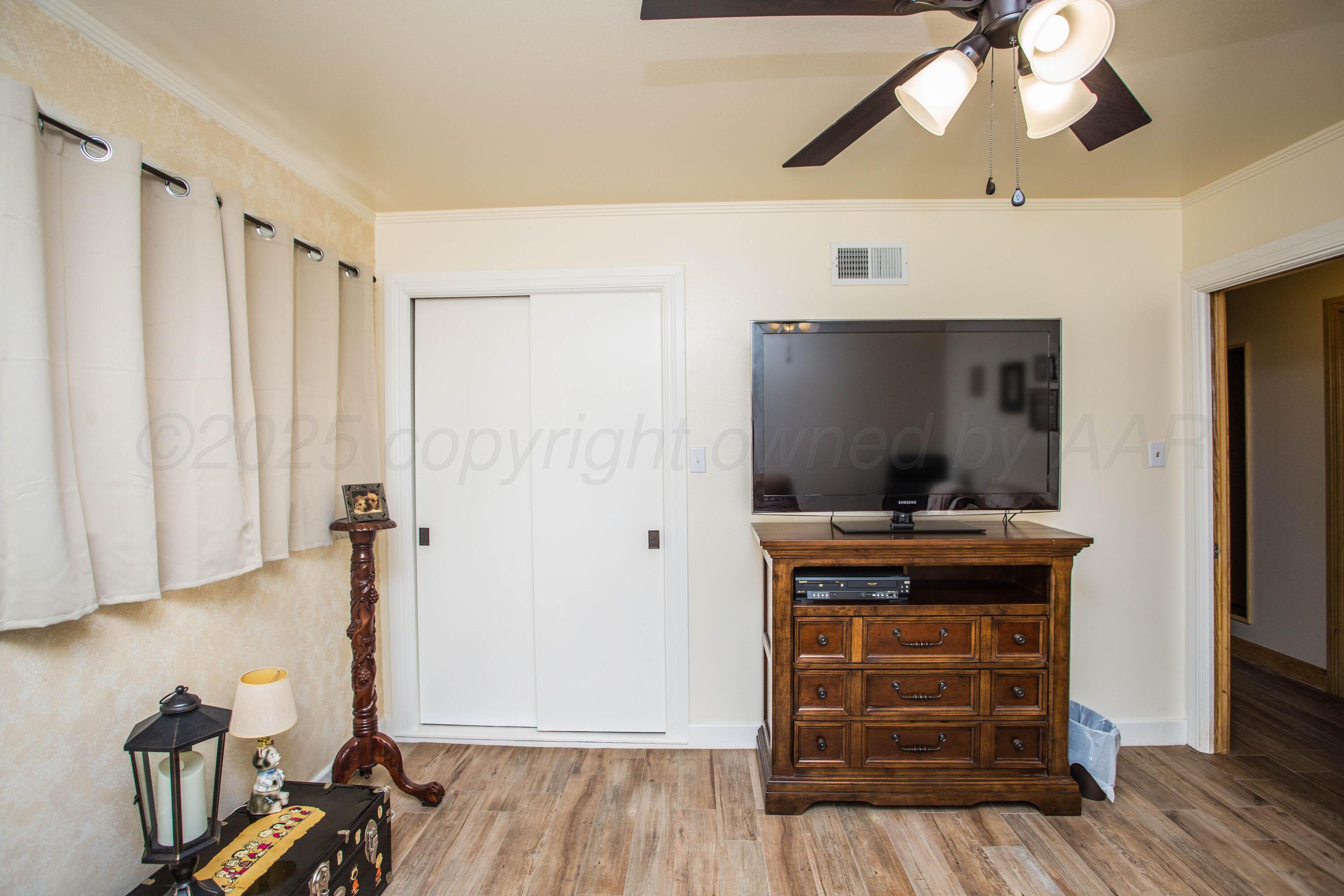 402 Northwest 6th Street Tulia, TX 79088 - Photo 32 of 59 a view of a workspace with wooden floor and staircase