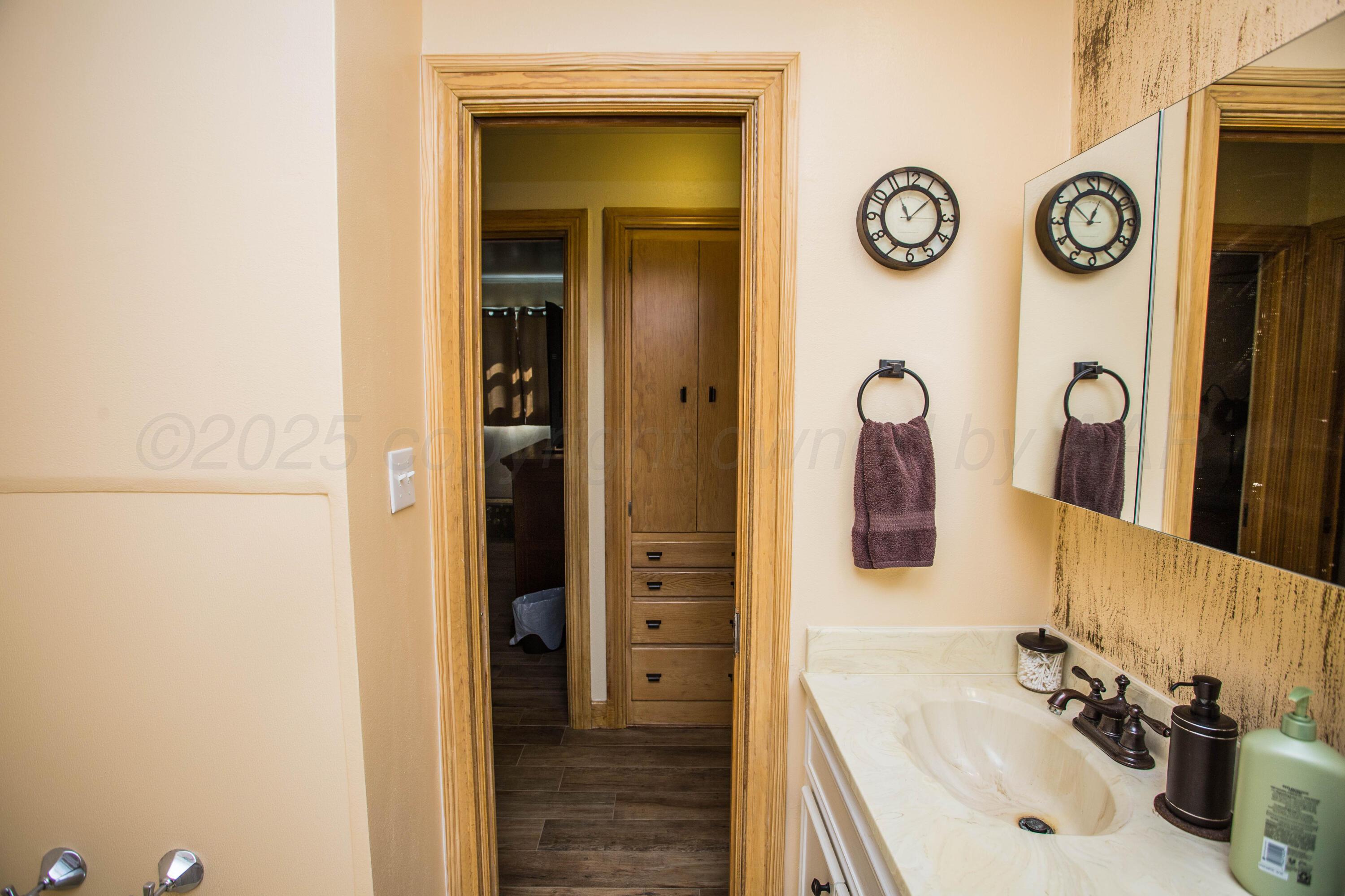 402 Northwest 6th Street Tulia, TX 79088 - Photo 35 of 59 a bathroom with a sink and a mirror