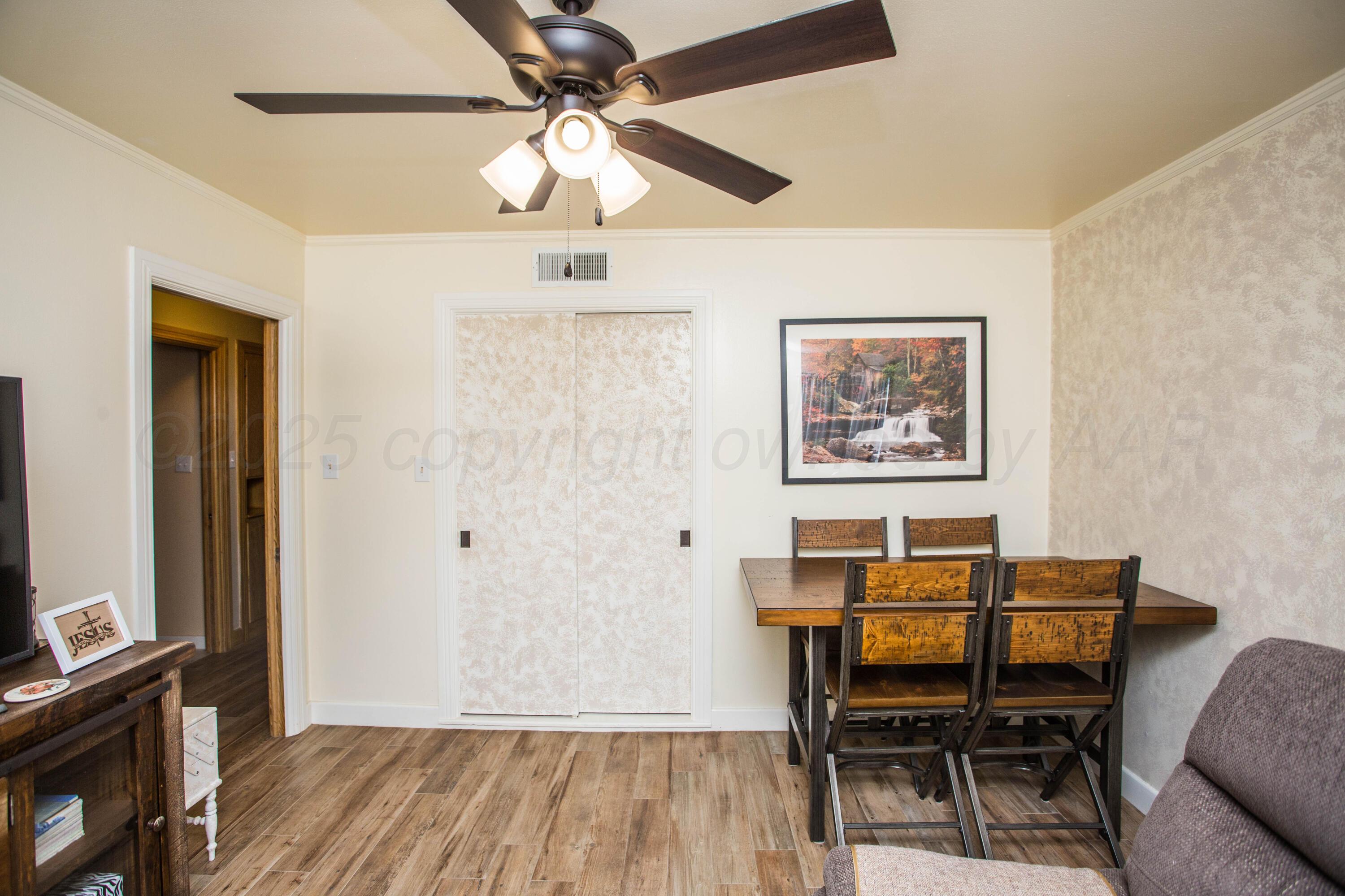 402 Northwest 6th Street Tulia, TX 79088 - Photo 37 of 59 a workspace room with furniture and wooden floor