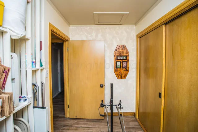 a bathroom with a tub a sink and a mirror