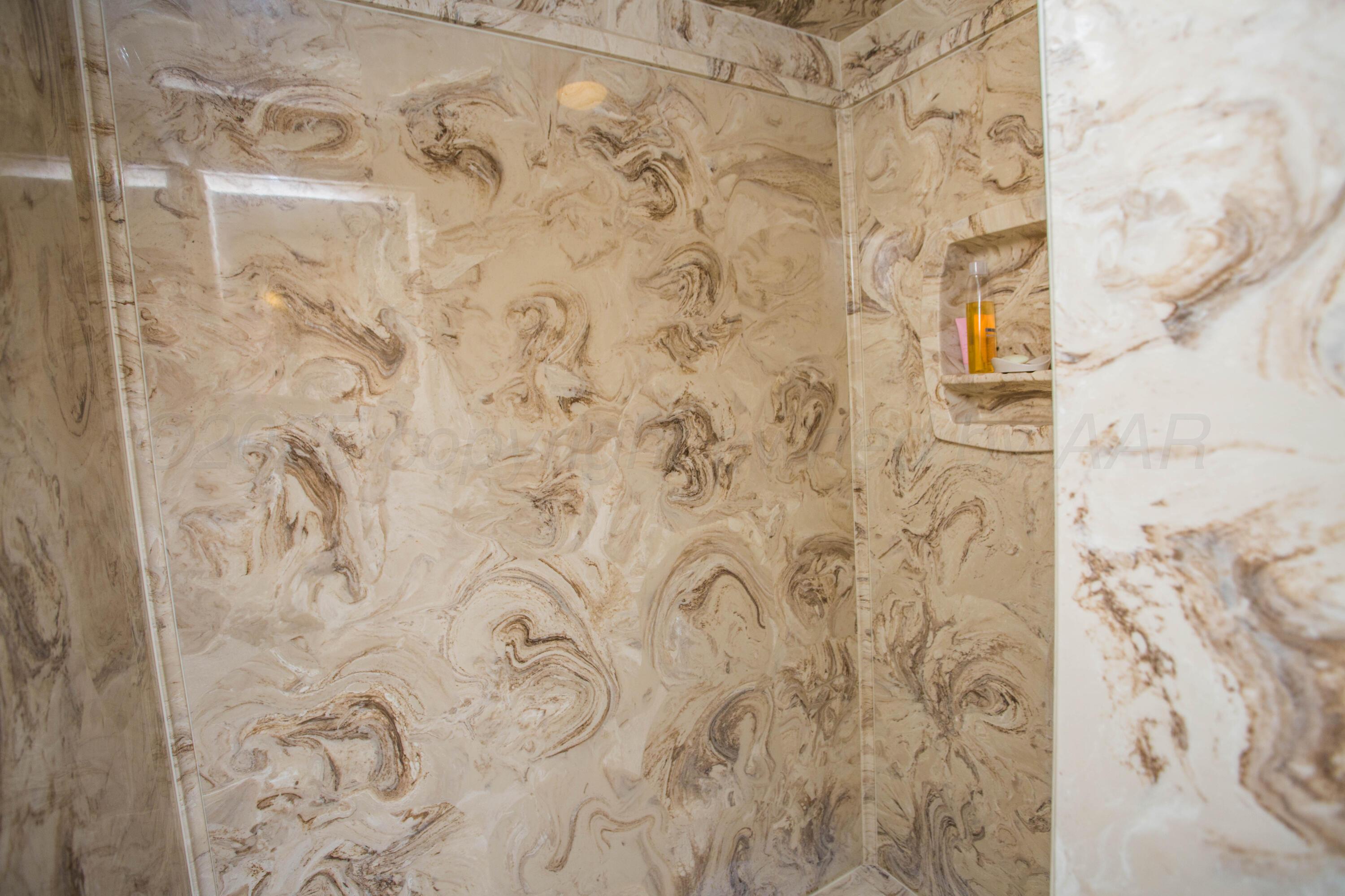 402 Northwest 6th Street Tulia, TX 79088 - Photo 43 of 59 a bathroom with a shower curtain