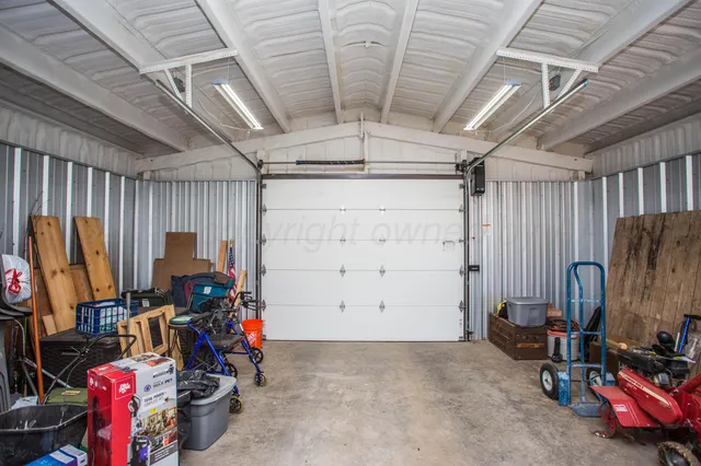 a patio with wooden floor a yard a table and chairs with wooden floor