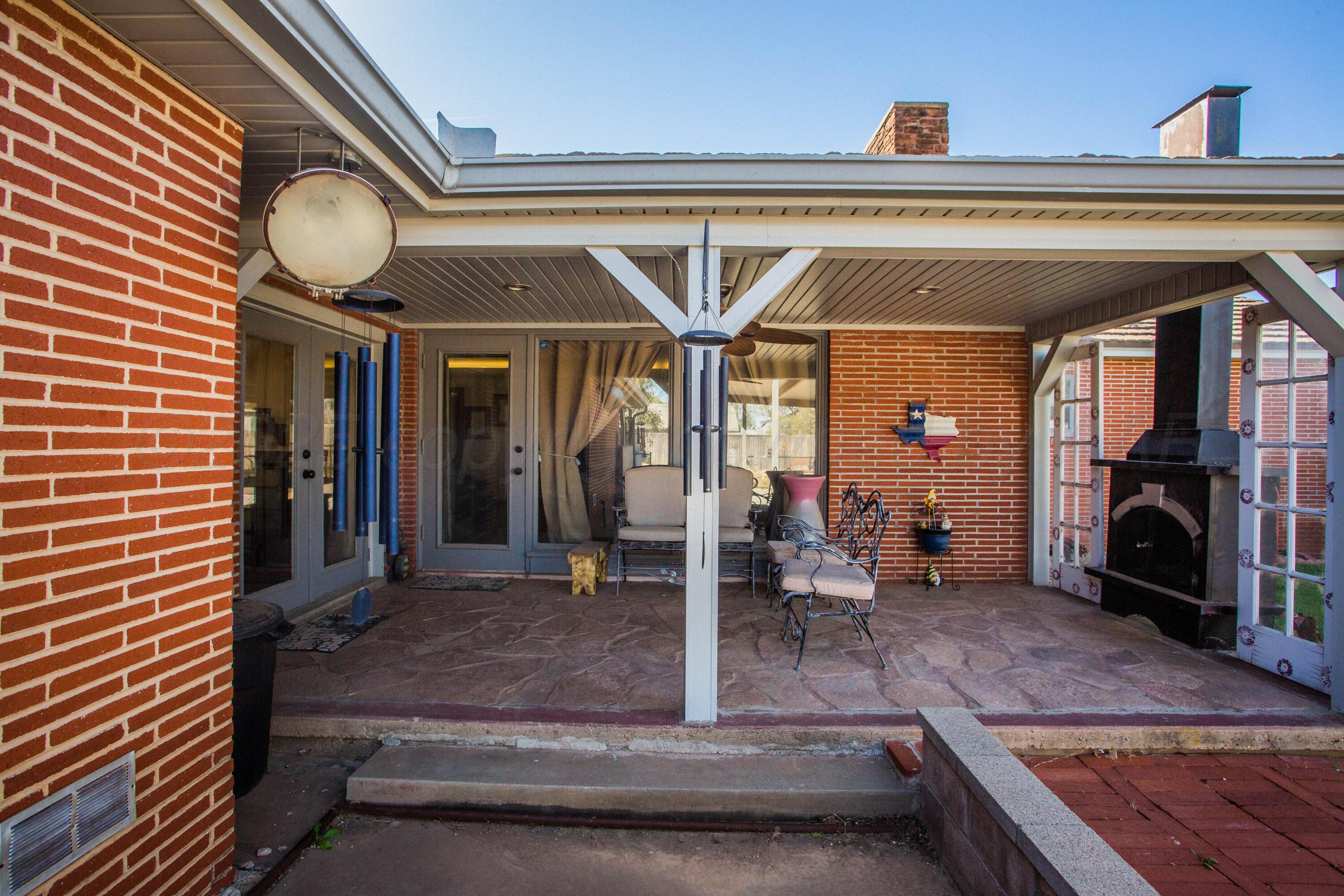 402 Northwest 6th Street Tulia, TX 79088 - Photo 55 of 59 a view of a hallway with a fireplace and workspace