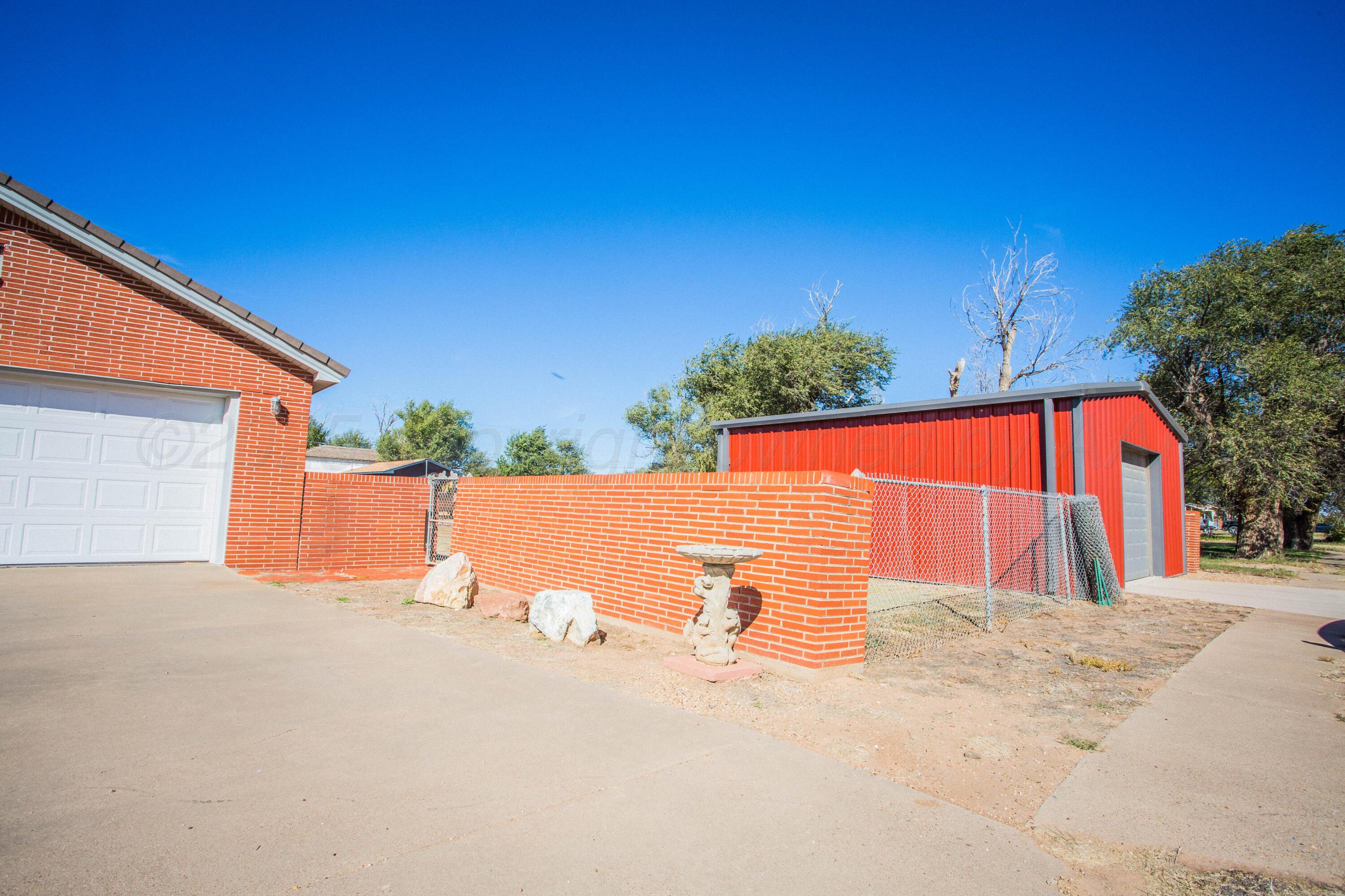 402 Northwest 6th Street Tulia, TX 79088 - Photo 7 of 59 a view of backyard with large tree