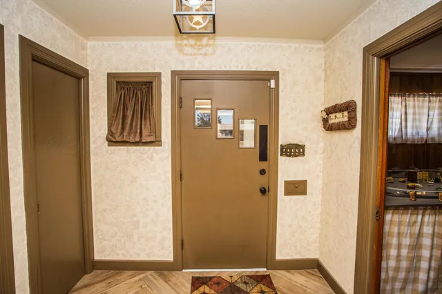 a view of a bedroom from a hallway
