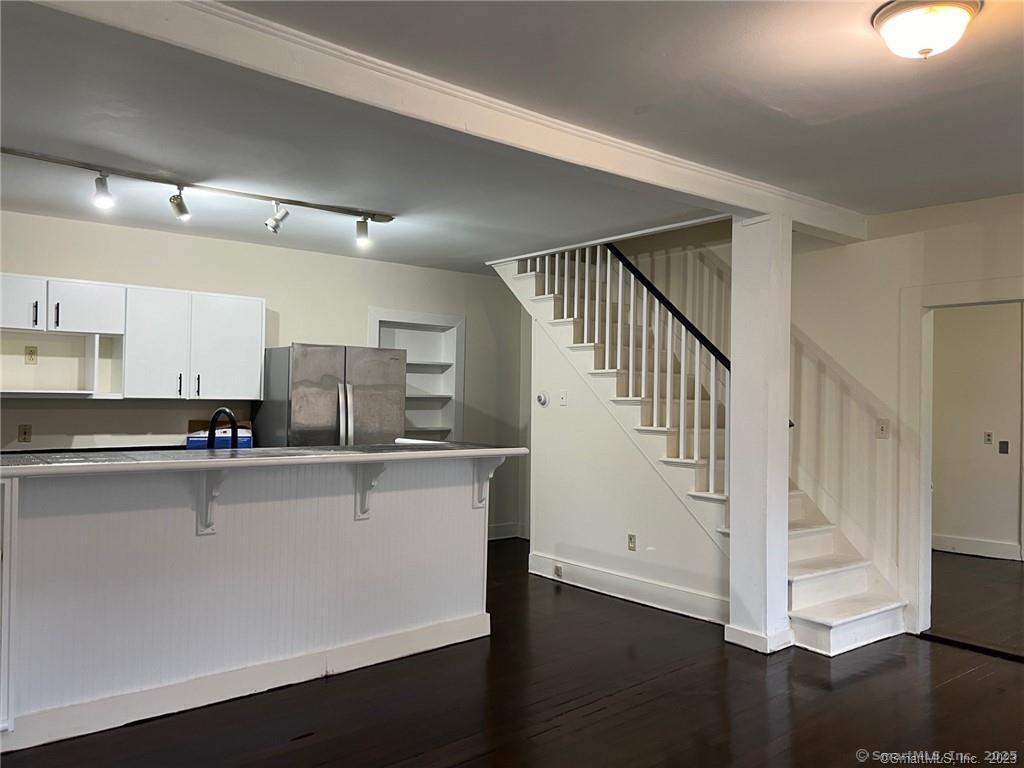 85 Prospect Hill Road, Unit 7 New Milford, CT 06776 - Photo 4 of 8 a kitchen with stainless steel appliances a sink and cabinets
