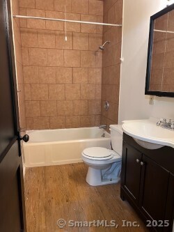 85 Prospect Hill Road, Unit 7 New Milford, CT 06776 - Photo 8 of 8 a bathroom with a toilet a sink and bathtub