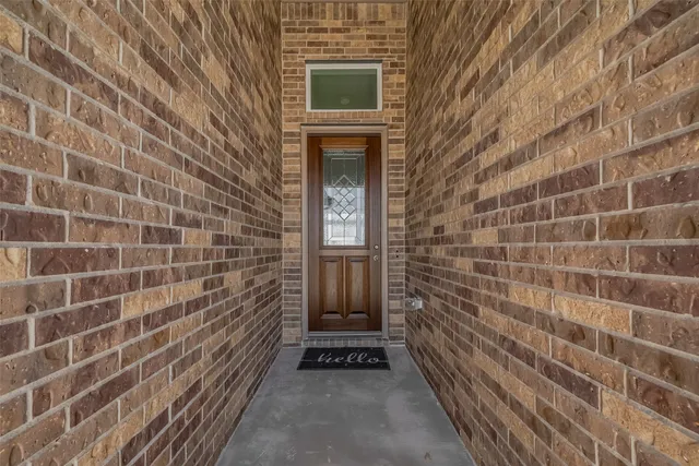 a view of a brick house with a door
