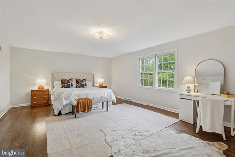 a view of a house with backyard sitting area and garden