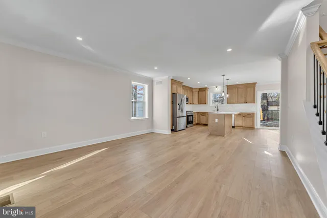 a view of kitchen and livingroom with furniture