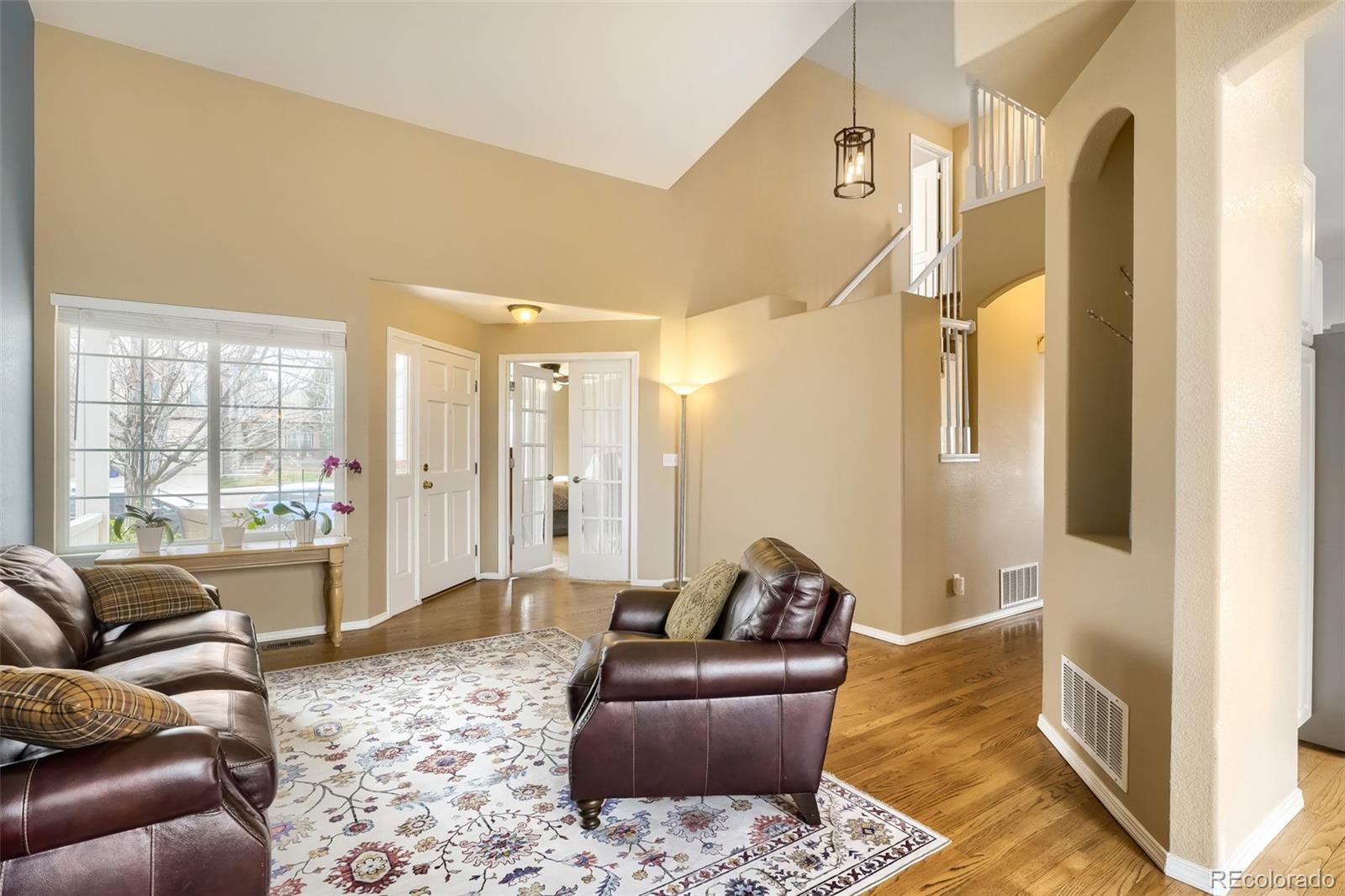 25 Estack Place Highlands Ranch, CO 80126 - Photo 5 of 28 a living room with furniture and a large window