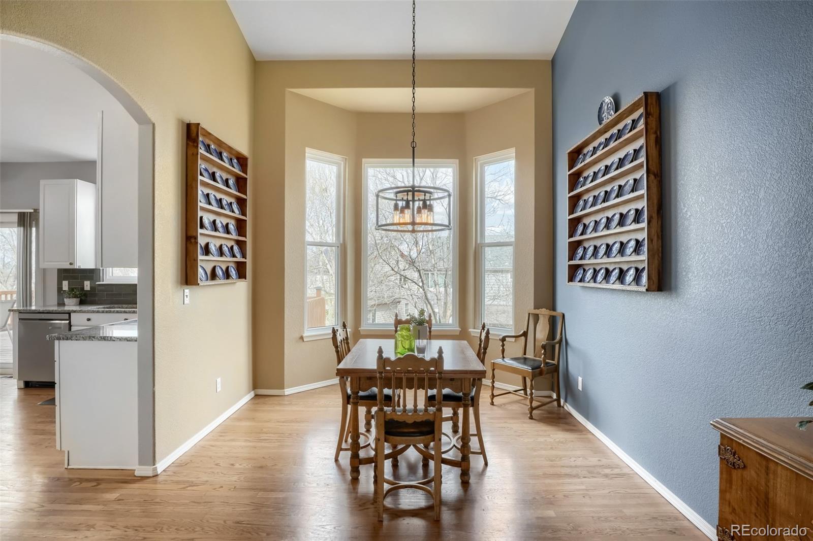 25 Estack Place Highlands Ranch, CO 80126 - Photo 9 of 28 a view of a dining room with furniture window and wooden floor