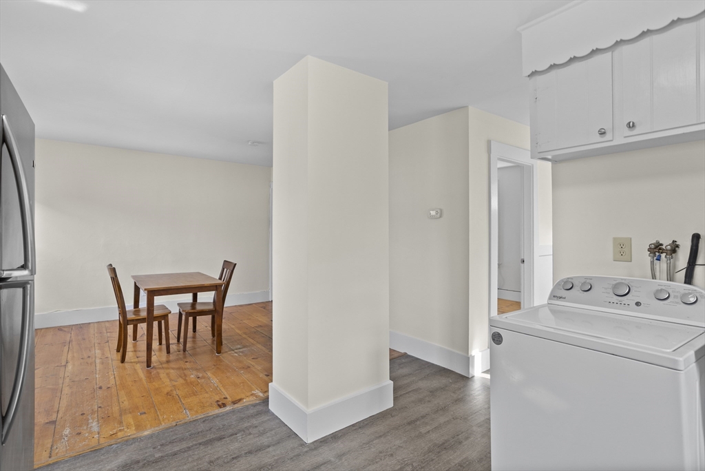 294 Great Road, Unit 2 Littleton, MA 01460 - Photo 13 of 18 a dining room with furniture and wooden floor