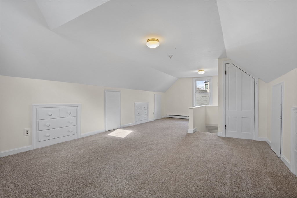 294 Great Road, Unit 2 Littleton, MA 01460 - Photo 17 of 18 a view of an empty room and chandelier fan